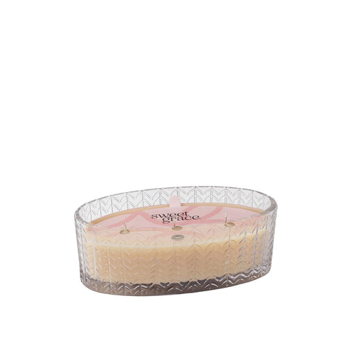 Sweet Grace candle in a glass holder on a white background