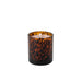 Tortoiseshell-patterned candle on a white background
