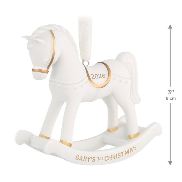 White rocking horse ornament with gold accents and 'Baby's 1st Christmas 2026' text, with dimensions indicated.