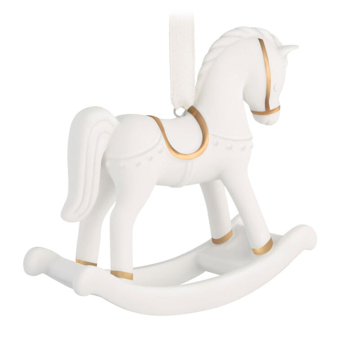 White rocking horse with gold accents on a white background