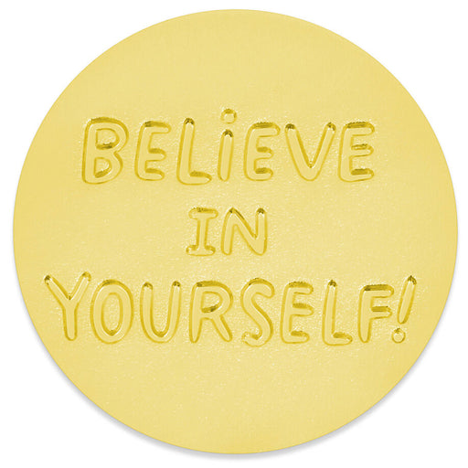 A round gold token with the words 'BELIEVE IN YOURSELF!' embossed in the center, shown on a clean white background.