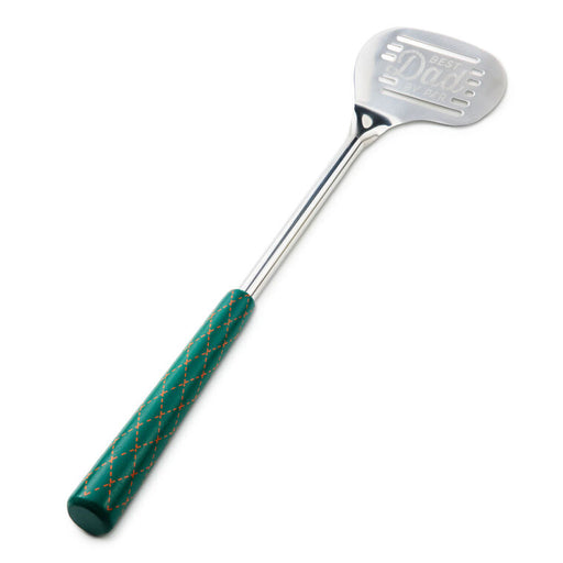 Metal spatula with green handle on a white background