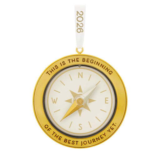 Gold compass ornament with 'This is the beginning of the best journey yet.' text on a white background