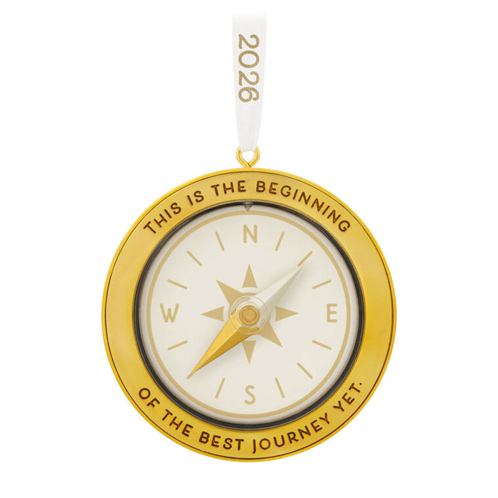 Gold compass ornament with 'This is the beginning of the best journey yet.' text on a white background