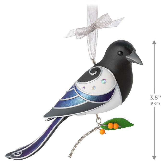 Decorative bird ornament with a white ribbon on a white background