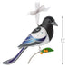Decorative bird ornament with a white ribbon on a white background