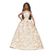 Barbie doll wearing a beige and white floral gown on a white background