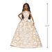 Barbie doll in a beige and white patterned dress with a measurement label on a white background