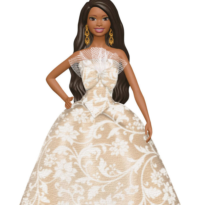 Barbie doll in a beige and white patterned gown on a white background