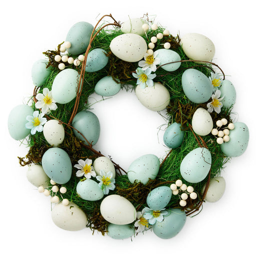 Easter wreath with eggs and flowers on a white background