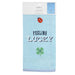 Packaged tea towel with 'Feeling Lucky' text and graphics on a white background