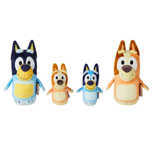 Set of four cartoon-style plush toys on a white background