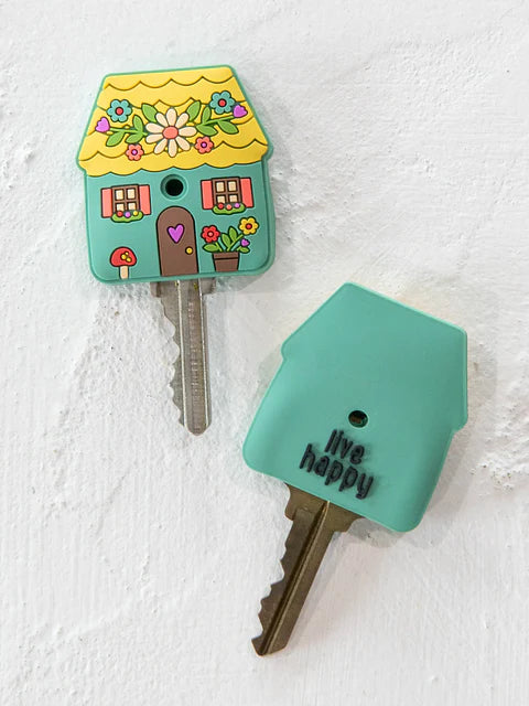 Decorative key cover shaped like a house with a colorful design on a white background