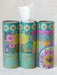 Three colorful tissue paper rolls with floral designs on a white background