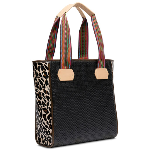 Black woven handbag with leopard print corner and striped handles on a white background