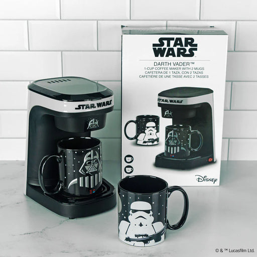 Star Wars coffee maker with Darth Vader and Stormtrooper mugs on a tiled wall background