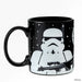 Black mug with a white stormtrooper design on a white background
