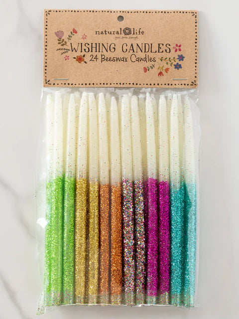 Packaged set of colorful wishing candles with 'natural life' branding on a light background