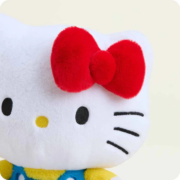 Plush toy with a red bow on a white background