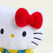 Plush toy with a red bow on a white background