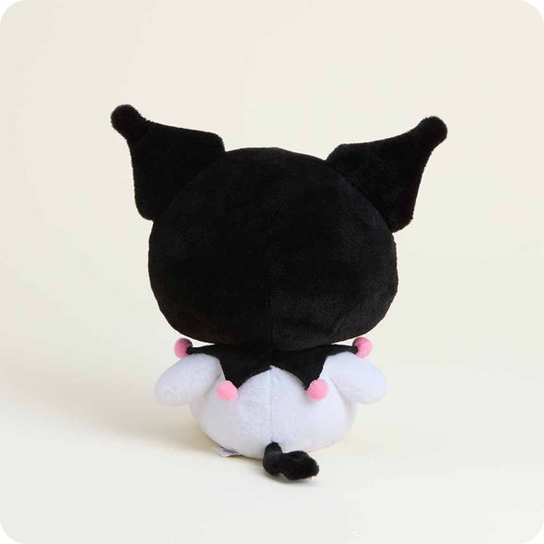 Black and white plush toy with pink pom-poms on a light gray background