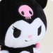 Plush toy with black and white face, pink skull on head, and pink cheeks.