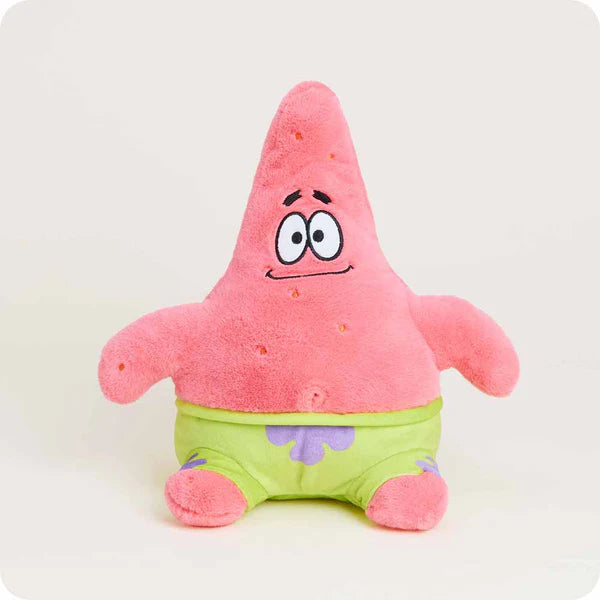 Plush toy of a pink starfish with green shorts on a white background