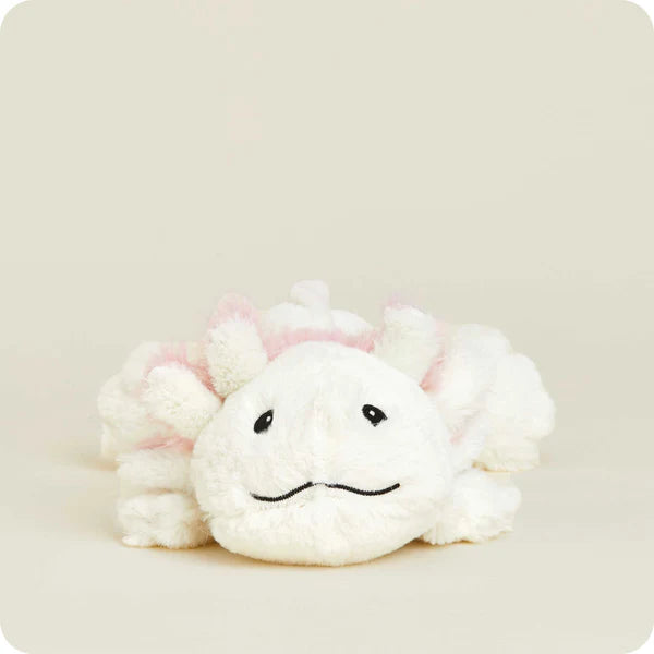 White plush toy with pink accents on a light beige background