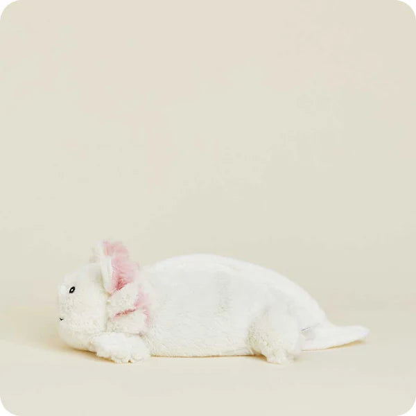 White rabbit plush toy on a beige background