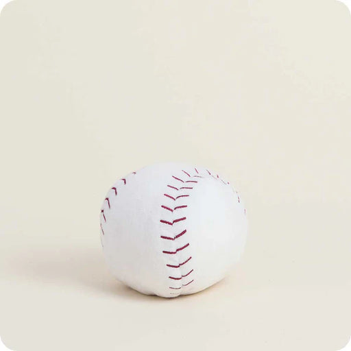 White baseball with red stitching on a beige background