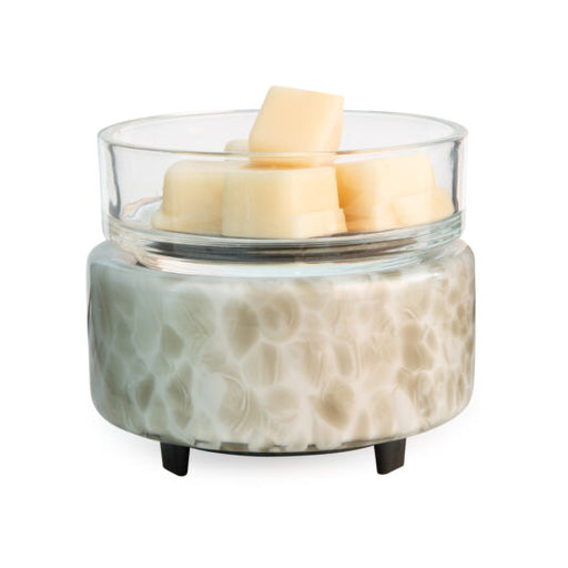 Ceramic wax warmer with glass lid on a white background