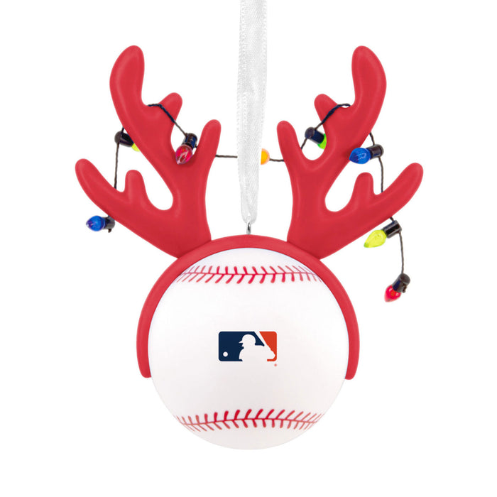 A holiday ornament shaped like a baseball with red reindeer antlers and hanging multicolor Christmas lights, featuring the MLB logo on the front, shown on a plain white background.