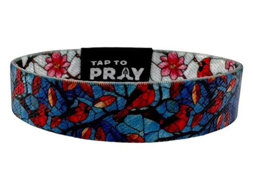 Colorful headband with floral and bird pattern on a white background