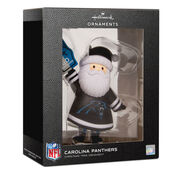 Hallmark NFL Carolina Panthers Santa ornament in its original black window box packaging, featuring a white beard and black hat with a blue and white helmet.