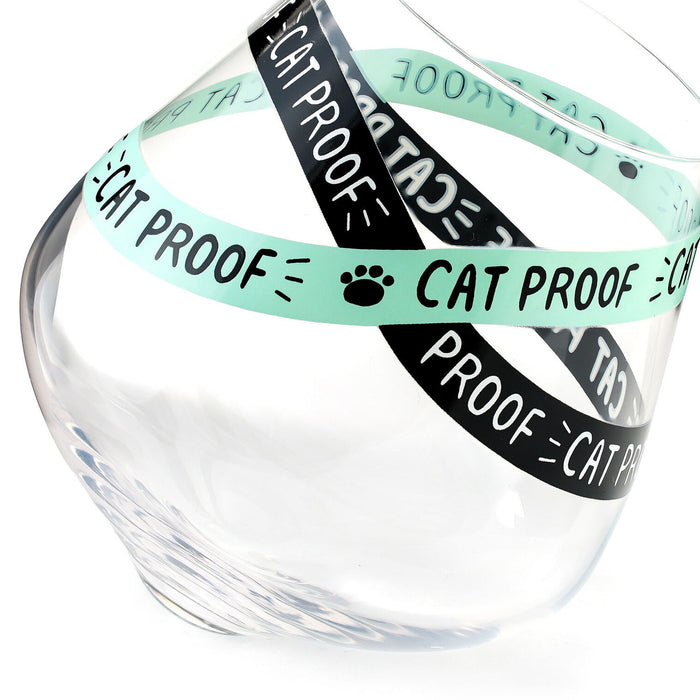 Clear glass bowl with multiple 'CAT PROOF' labels on a white background