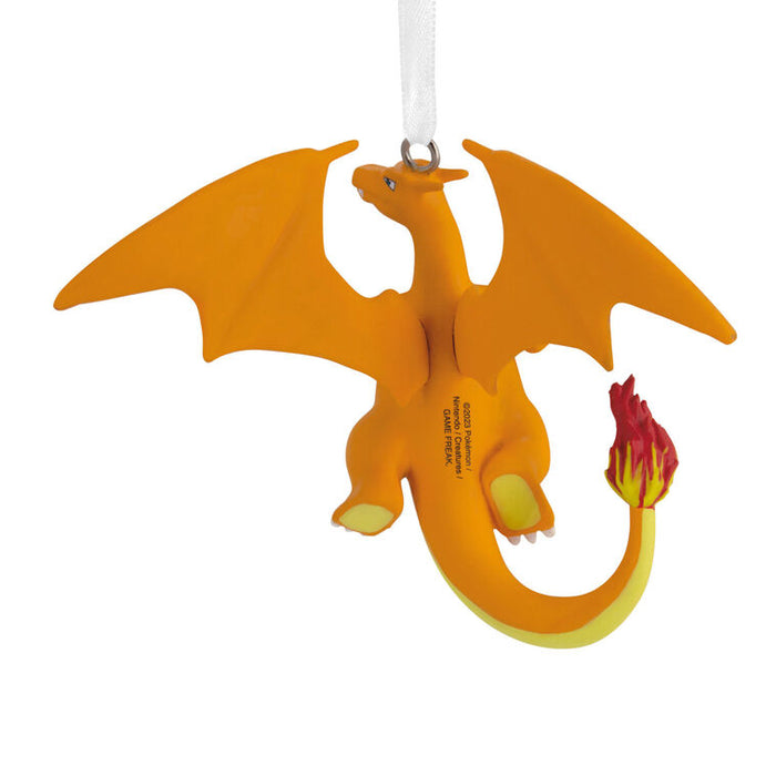 Orange dragon ornament with a flame on a white background