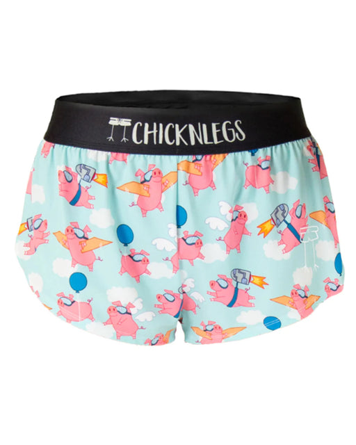 Cartoon shorts with pigs and rocket designs on a light blue background, featuring 'ChickenLegs' brand.