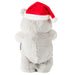 Plush bear wearing a red Santa hat on a white background