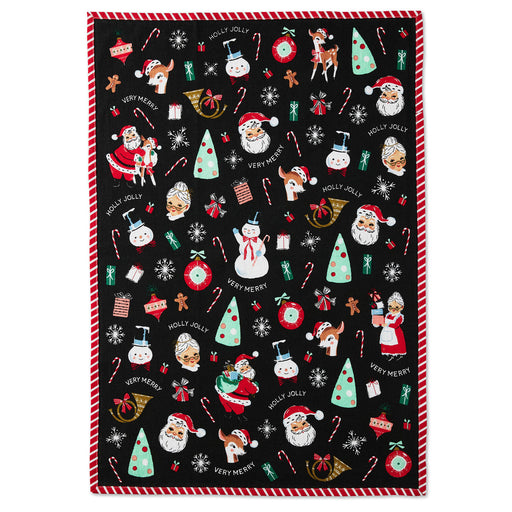 Christmas-themed tea towel with festive designs on a black background