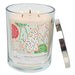 Candle in a glass jar with a Christmas-themed cookie label on a white background