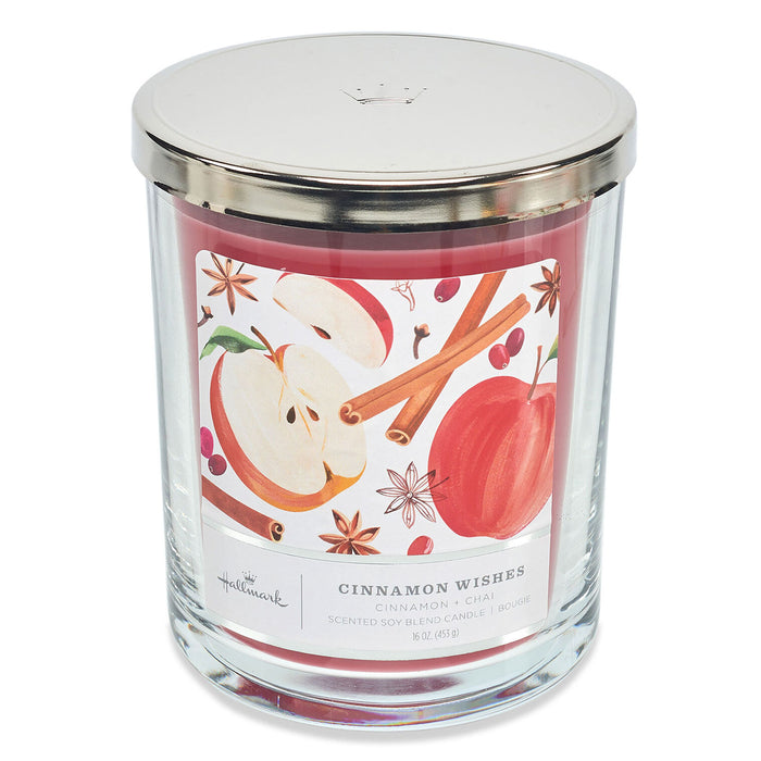 Candle jar with apple and cinnamon design on a white background