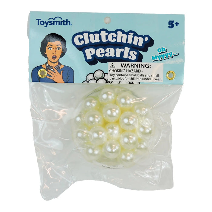 Packaged toy 'Clutchin' Pearls' by Toysmith with warning label on a white background