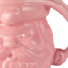 Close-up of a pink ceramic elephant mug with textured surface
