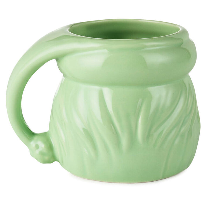 Green ceramic mug with a textured surface on a white background