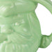 Green ceramic mug with a face design on a white background