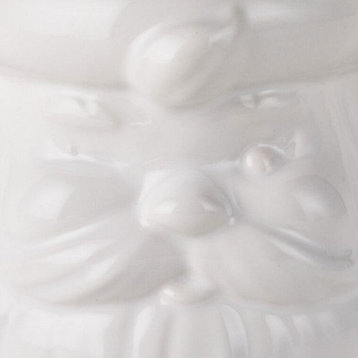 Close-up of a white ceramic sculpture with a smooth texture