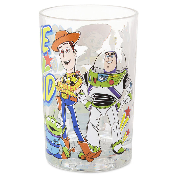 A clear plastic tumbler featuring a colorful printed graphic of Woody, Buzz Lightyear, and Alien from Toy Story on a white background.