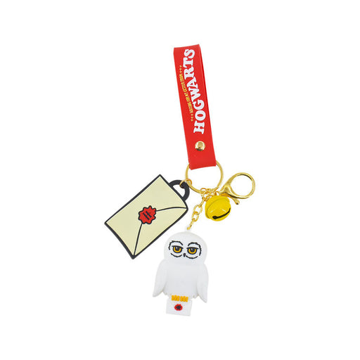 Keychain with owl, envelope, and bell on a white background