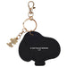 Black keychain shaped like a piggy bank with a gold tag on a white background
