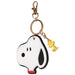 Keychain shaped like a dog with a gold tag on a white background